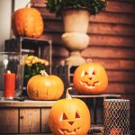 Pumpkins on front step with halloween decorations