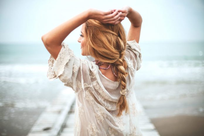 Dreamy girl on beach