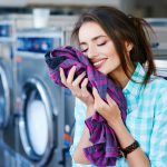 Woman feeling softness of colorful blouse