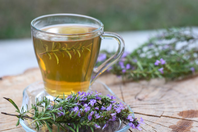 Cup,Of,Fresh,Natural,Tea,On,Wooden,Table.,Thymus,Serpyllum
