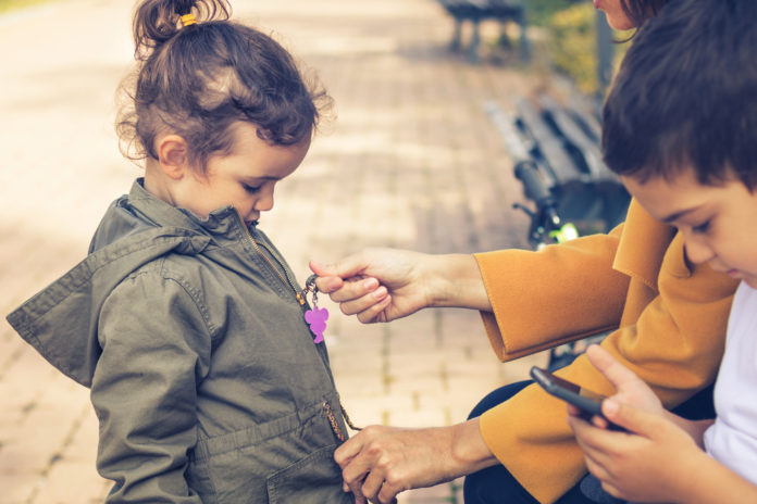 Mother,Zipping,Up,Daughter's,Jacket.,Little,Girl's,Mother,Helping,Her