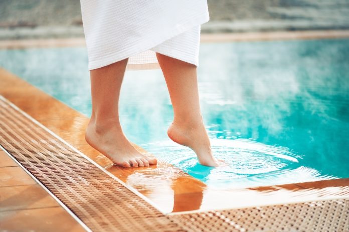 A,Girl,Puts,Her,Foot,In,A,Pool,With,Hot