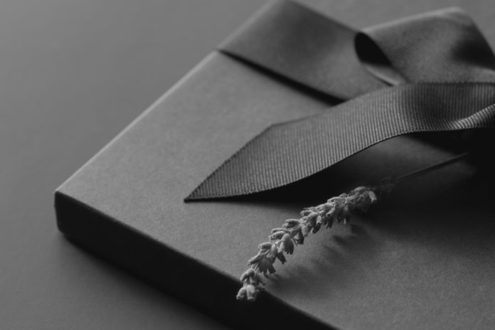 Black,Gift,Box,On,A,Dark,Background,,Decorated,With,A