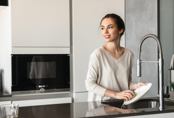 Portrait,Of,A,Beautiful,Young,Woman,Washing,Dishes,At,The