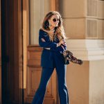 beautiful-smiling-woman-dressed-elegant-suit-sunglasses-walking-street-smiling-sunny-weather