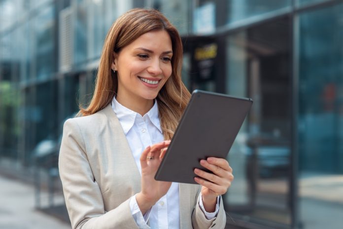 Portrait,Of,A,Successful,Business,Woman,Using,Digital,Tablet