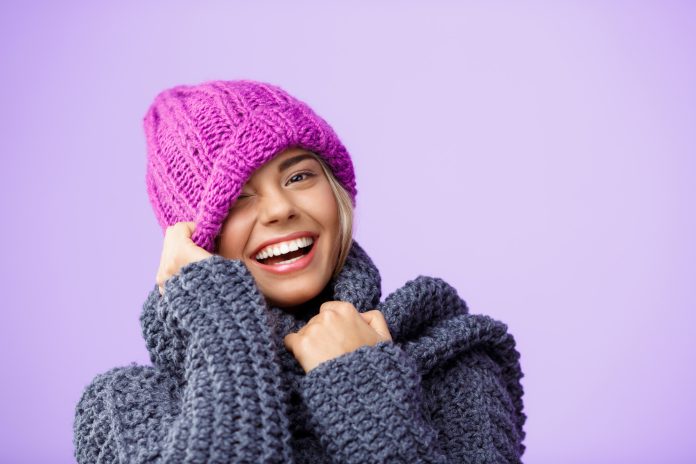 young-beautiful-fair-haired-woman-knited-hat-sweater-smiling-winking-violet