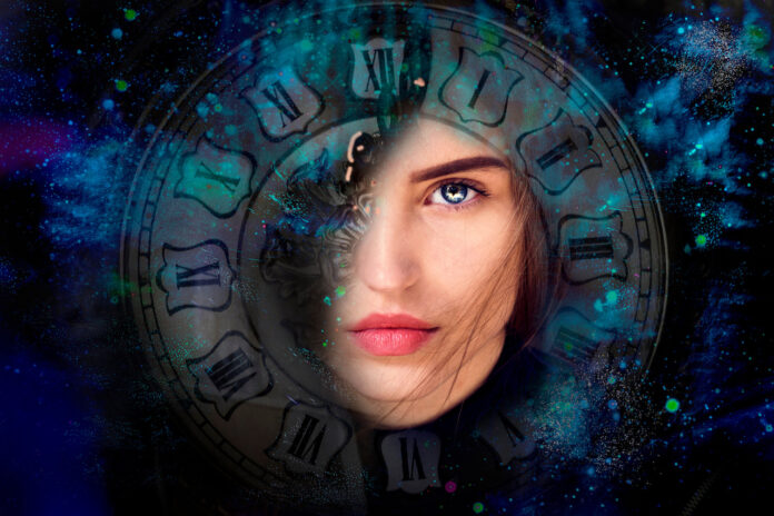 Beautiful woman with blue eyes on a background of space and a vintage watch